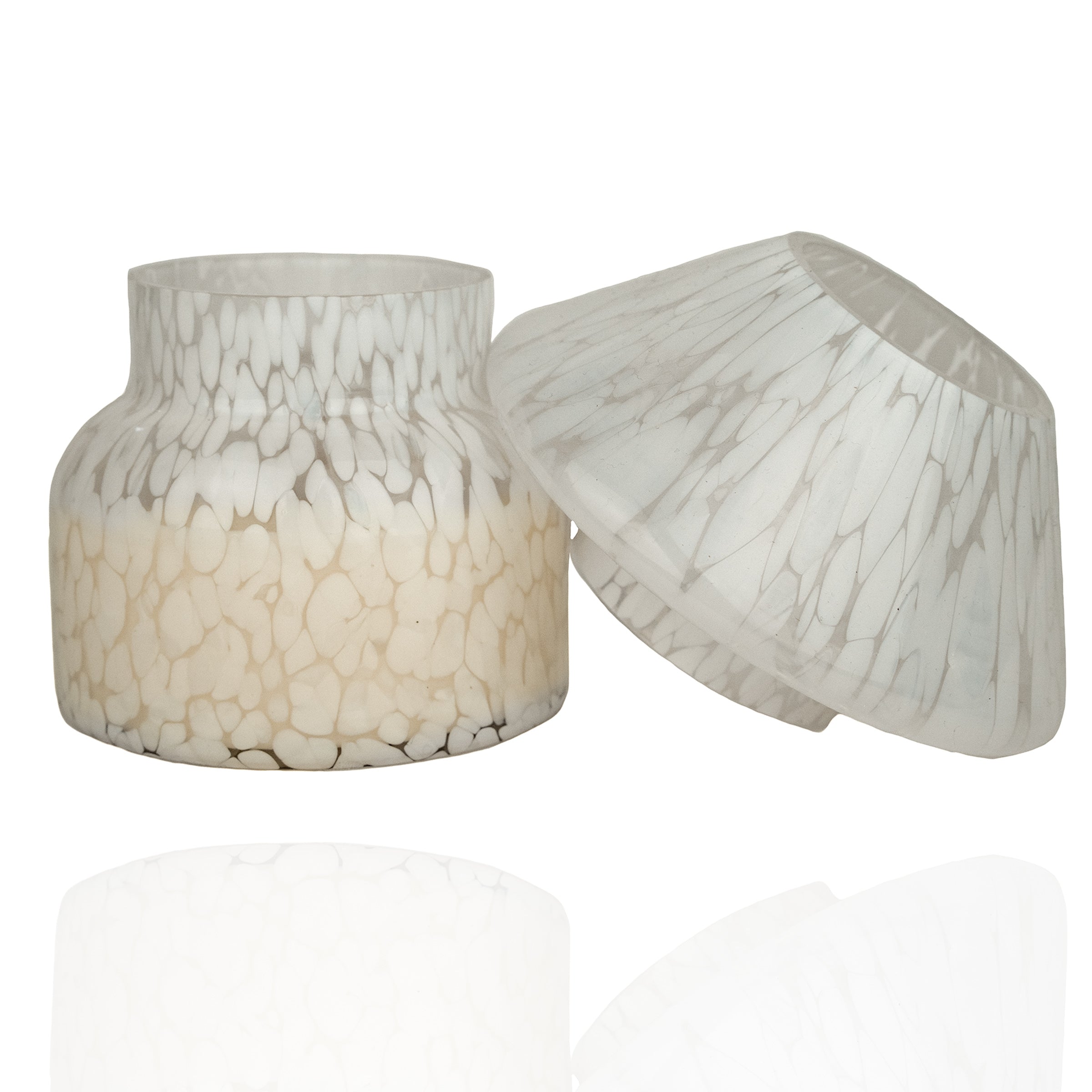 Mushroom candle lamp with white spots on clear glass and lid ajar. Filled with 100% soy wax.