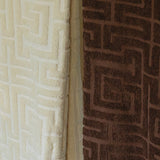 Close-up of textured beige and brown towel with geometric patterns.