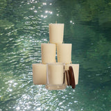 Stack of candles above water