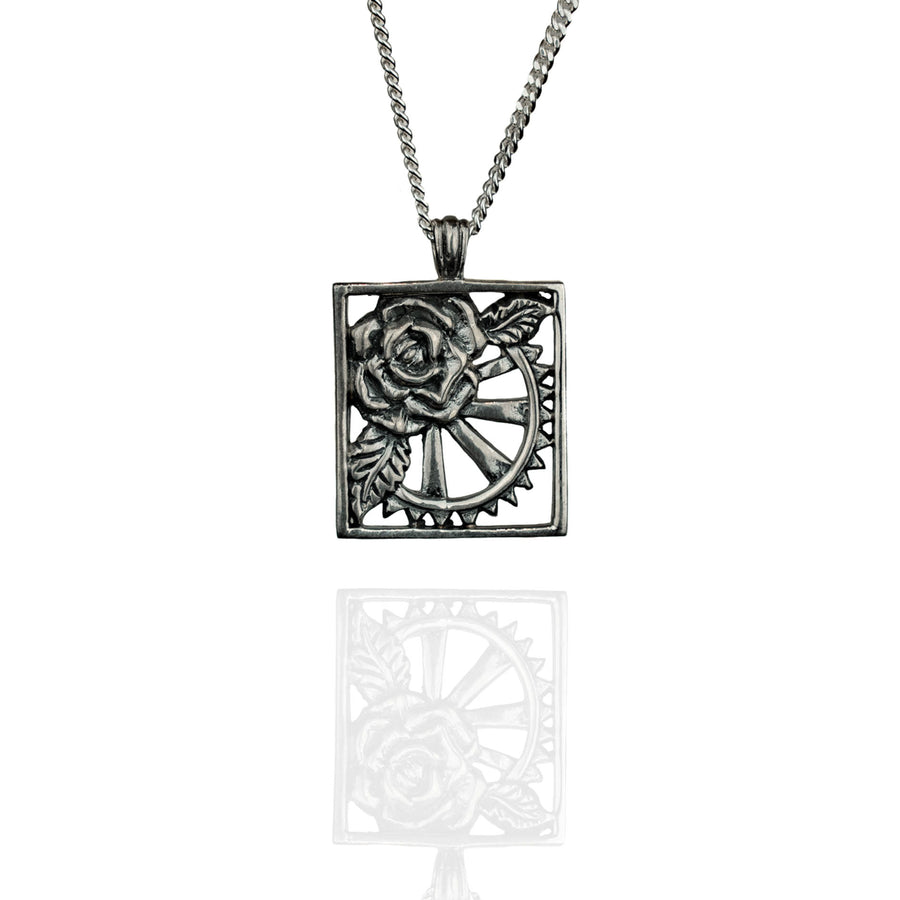 Silver rose and cart wheel necklace