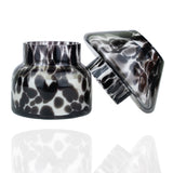 Dalmation spotted black glass mushroom candle lamp with lid ajar. Filled with 100% soy wax.