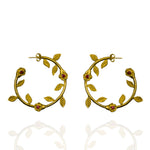 Gold rose hoop earrings with garnet stones