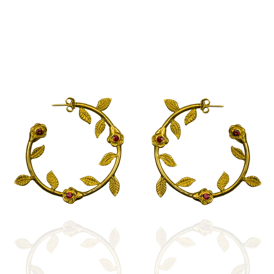 Gold rose hoop earrings with garnet stones