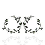 Silver rose hoop earrings with peridot stones