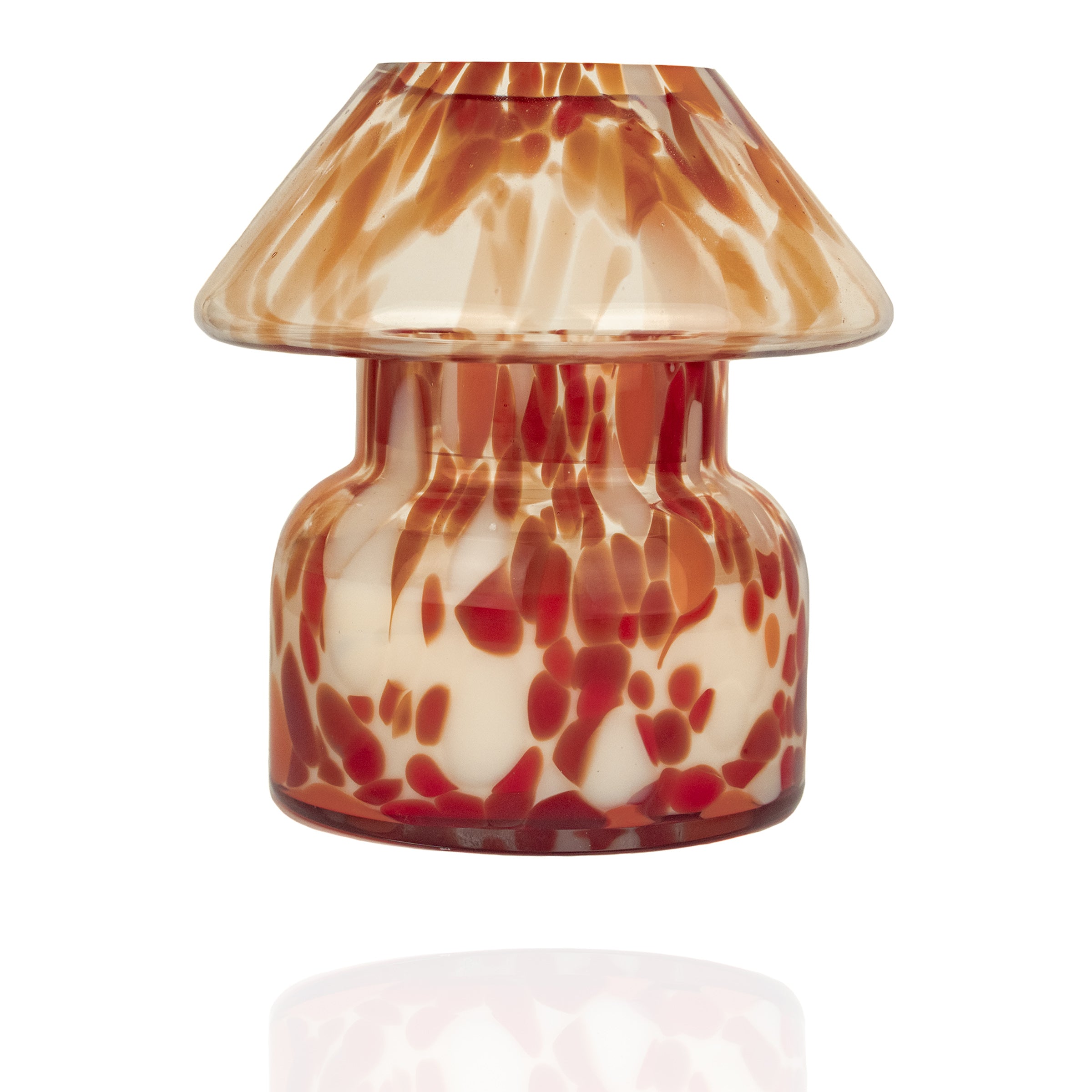 Mushroom candle lamp with red, orange and white spots on clear glass. Retro lamp is filled with 100% soy wax